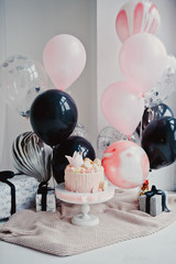 Holiday for girl - balloons and princess cake on a white background