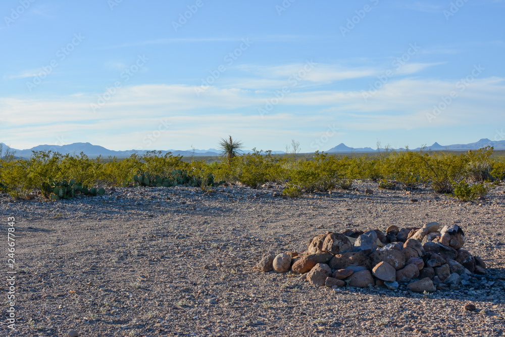 Wall mural campsite with a fire pit in the texas desert near the u.s. mexico international border.