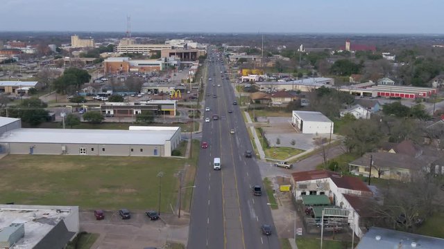 AERIAL: small town street traffic view