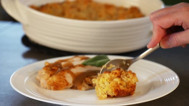 Scooping stuffing onto plate