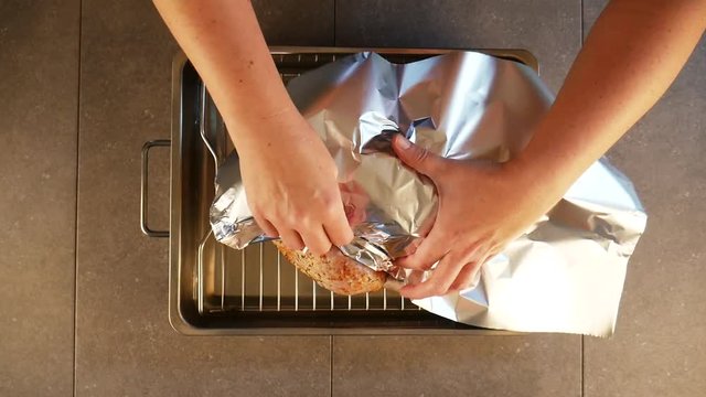Covering turkey in foil