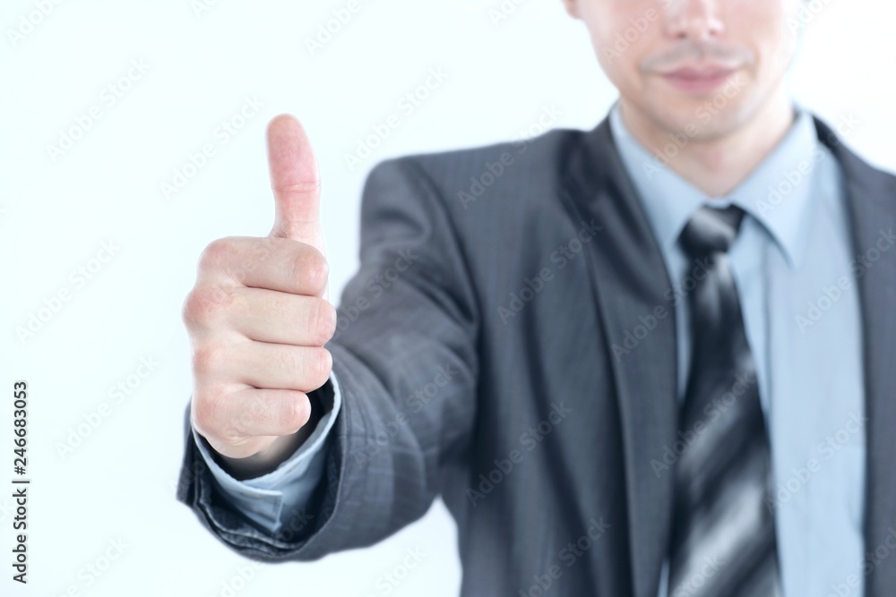 Wall mural closeup.young business men showing thumb up. photo with copy space