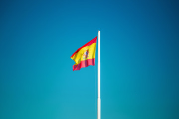 flag of spain on blue sky background