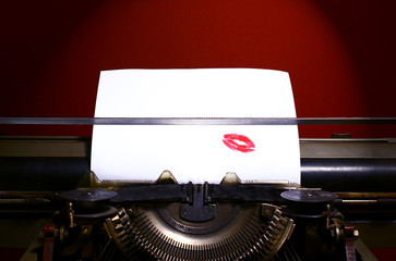 Red lipstick print on paper.