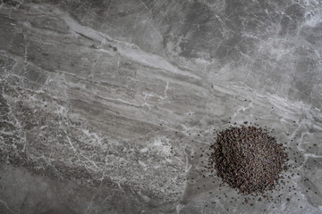 Organic Poppy Seeds on a marble kitchen worktop background