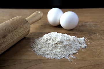 Rolling pin, eggs, and flour.