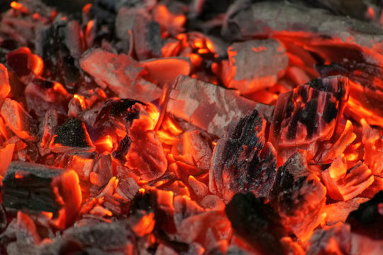 Glowing embers in hot red color, abstract background