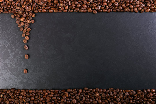 Aroma roasted coffee beans on rustic tabletop, brown banner background.