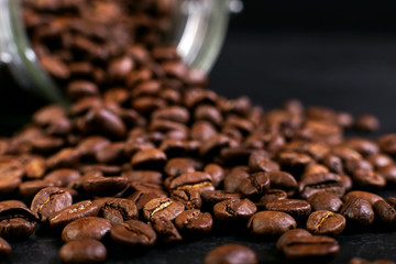 The can of coffee is turned upside down, with scattered beans. Macro copy space.