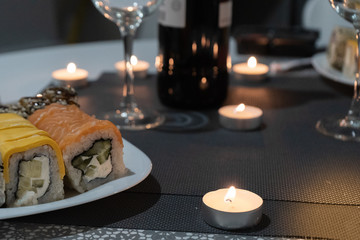Sushi and candles in a romantic atmosphere
