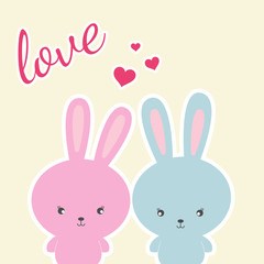 Obraz premium Colored two Rabbits on a white background and slogan love.
