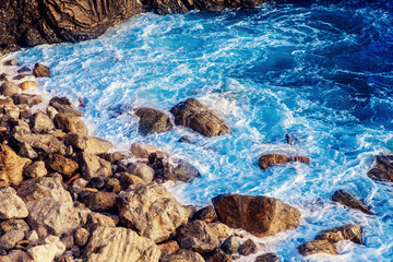 Huge rocks in sea, small Bay among mountains
