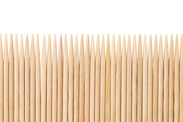 Bamboo toothpicks are placed in parallel - backgrounds, textures. Bamboo toothpicks isolated on...