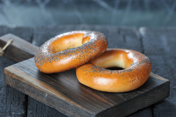 bagels with poppy seeds on a wooden Board