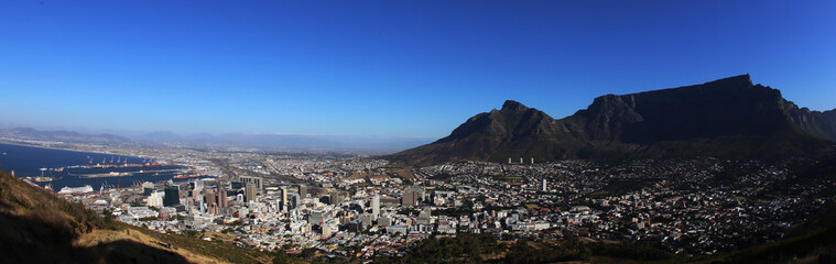 A Panorama of Cape Town and Table Mount on a sunny day as seen from Lions Tail, South Africa.