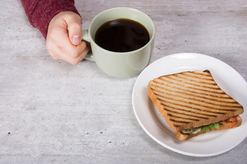 Breakfast. Sandwich and coffee. 