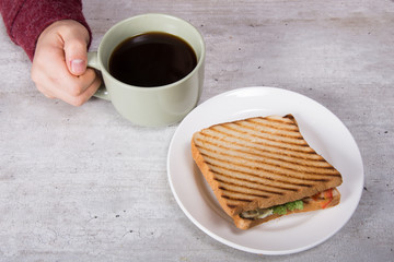 Breakfast. Sandwich and coffee. 