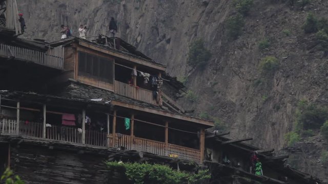 Colourful dressed People at a Kalash People residence in the mountains, Pakistan