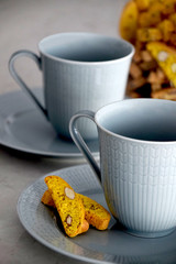 Close up on cups of coffee and biscotti