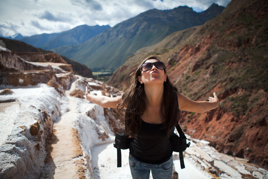 Woman making kissing face on salt flats