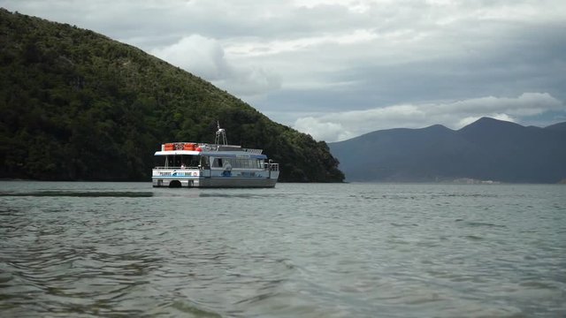 Pelorus Mail Boat In Marlborough Sounds, New Zealand With Green Hills In Background