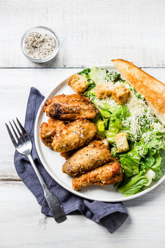 Chicken wings with caesar salad