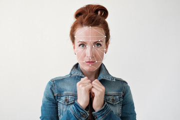 Face recognition of a middle aged red haired woman