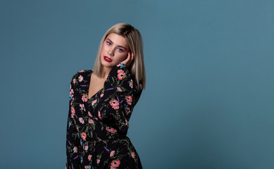 Cute lovely young blonde woman in summer dress