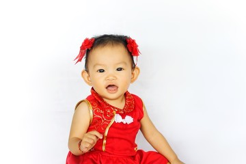 Chinese New Year festival concept, a Chinese 's baby girl in the red clothes. She holding a pocket money gift in her hand. On white background.