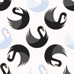 Seamless pattern with white and black swans turning around