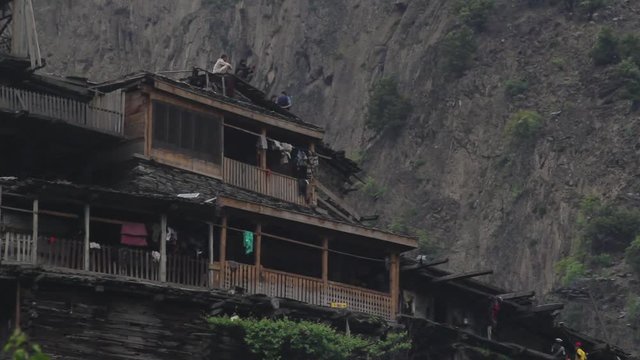 Time lapse of tourists and Kalash People at community housing in Pakistan