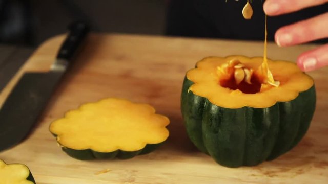 Person scoops out squash