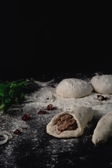 Lobiani - traditional dish of Georgian food. Baked closed pie or bread with white beans or red beans filling. Cooking process pie with beans, harincot, parsley, red pepper, flour, beans