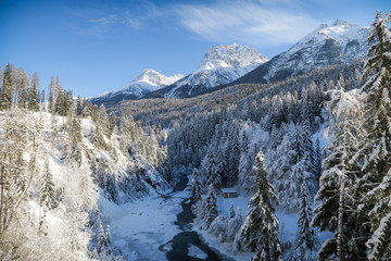 Winter wonderland with river in Switzerland