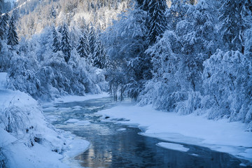 Winter wonderland with river in Switzerland