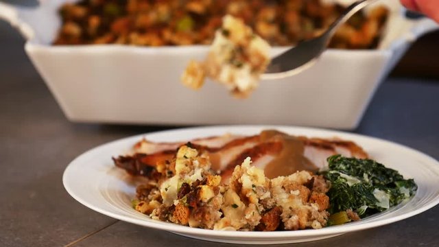 Fork lifts stuffing from plate