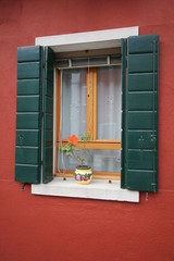 Rust walls and green shutters by Skip Weeks