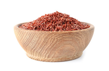 Bowl with uncooked brown rice on white background