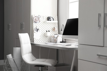 Light work place with computer at home. Interior design