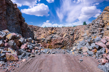 Spectacular view of quarry open pit mining of granite stone. Process production stone and gravel.