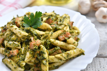 Penne pasta with spinach and meat