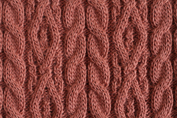 Brown-red acrylic knitted fabric texture. Macro.