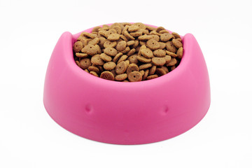 Dry cat food in pink bowl isolated on white