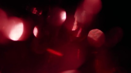 Natural created defocused red bokeh, light leaks. Creative motion background.