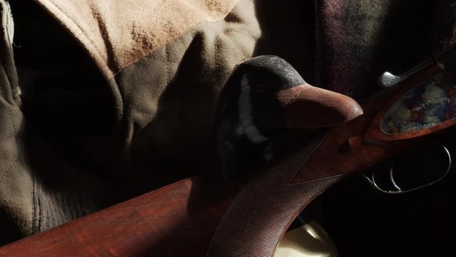 Beautiful Case Colored Shotgun with duck decoy.  Shot in bright sunlight.  Shot on BMC Cinema 4K with f.1.5.22  prime cine lens in Apple ProRes 422.  No color correction/grading done.