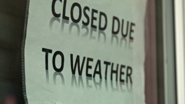 Closed Due to Weather Sign on Window DOLLY RIGHT