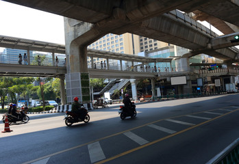 lifes in the city, group of people walking on overpass at intersection