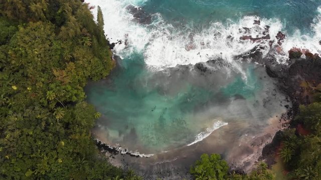 aerial pan upward of shipman beach puna Hawaii big island