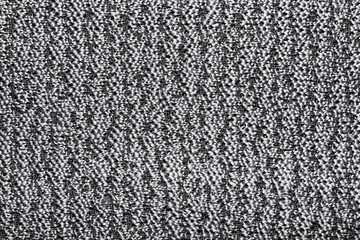 The texture of the knitted gray fabric for the background