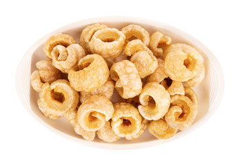Crispy Pork, in a disk isolated over the white background, Top view.